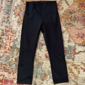 Lululemon black crop leggings, size 4, good condition.